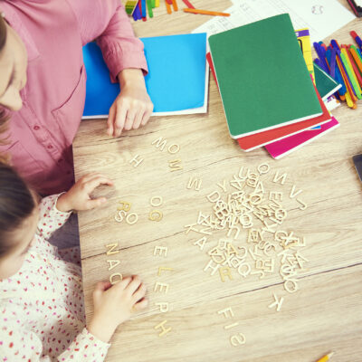 Girl learning the alphabet at home