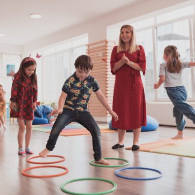 Small,Nursery,School,Children,With,Female,Teacher,On,Floor,Indoors Small,Nursery,School,Children,With,Female,Teacher,On,Floor,Indoors